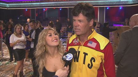 Michael Waltrip and Emma Slater giving an interview.